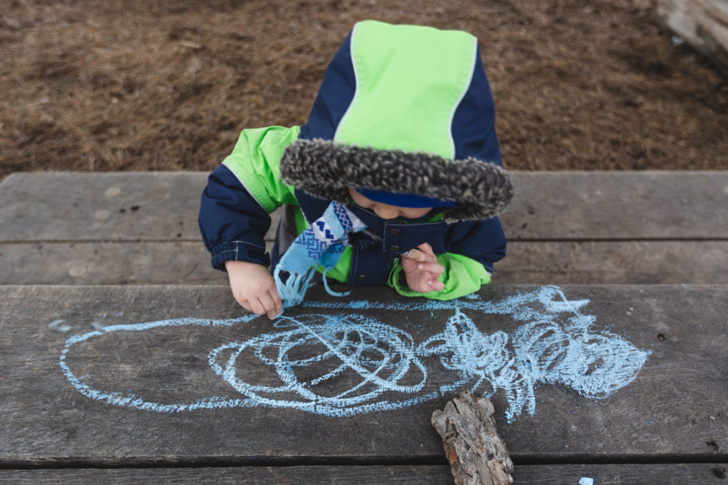 Child Drawing with chalk
