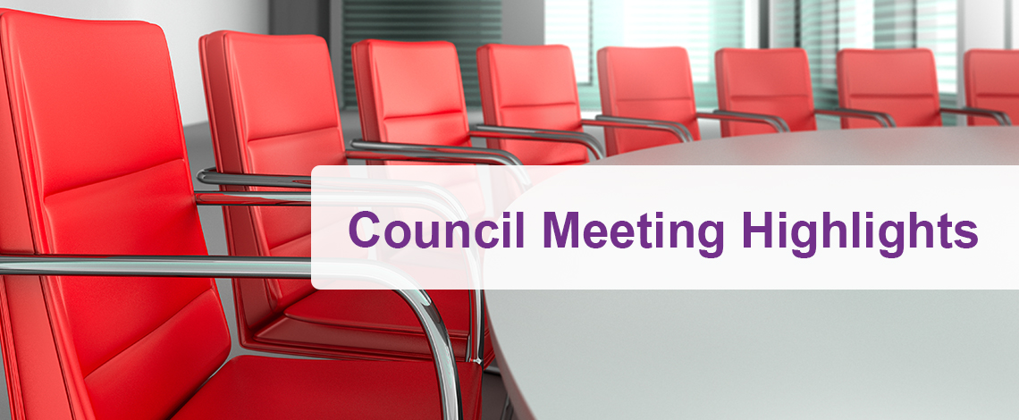 Red office chairs surround a table. Text displays, Council Meeting Highlights.