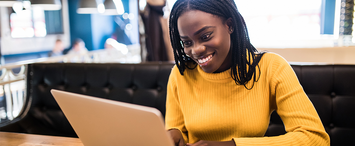 Woman looking at laptop screen.